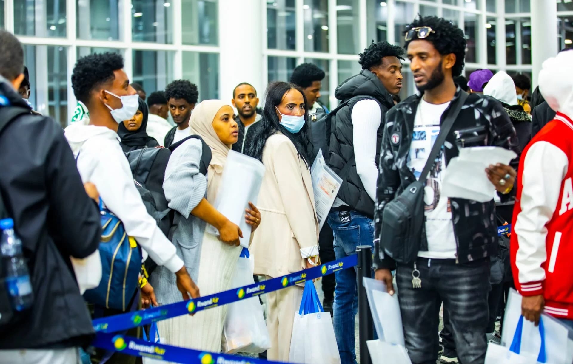 Newly arrived asylum seekers from Libya arrive at Kigali International Airport, Rwanda, before being transferred to the Gashora Transit Centre for protection, medical screening, and support.