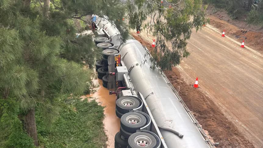 Sticky disaster: Truck crash turns M1 into molasses river south of Wollongong