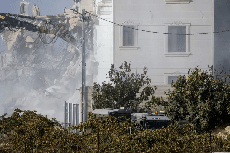 Israeli Prime Minister Benjamin Netanyahu has warned of a possible large-scale military operation and full lockdown in the occupied West Bank following a deadly shooting in Hebron that killed two Palestinians and two Israeli soldiers.