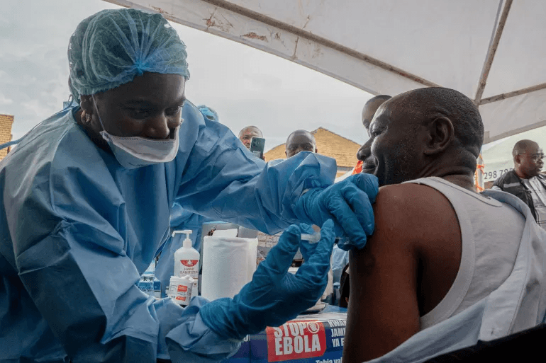A Congolese health worker receives an Ebola vaccine in North Kivu province, DR Congo, on October 16, 2026, as health authorities intensify efforts to contain the deadly outbreak.